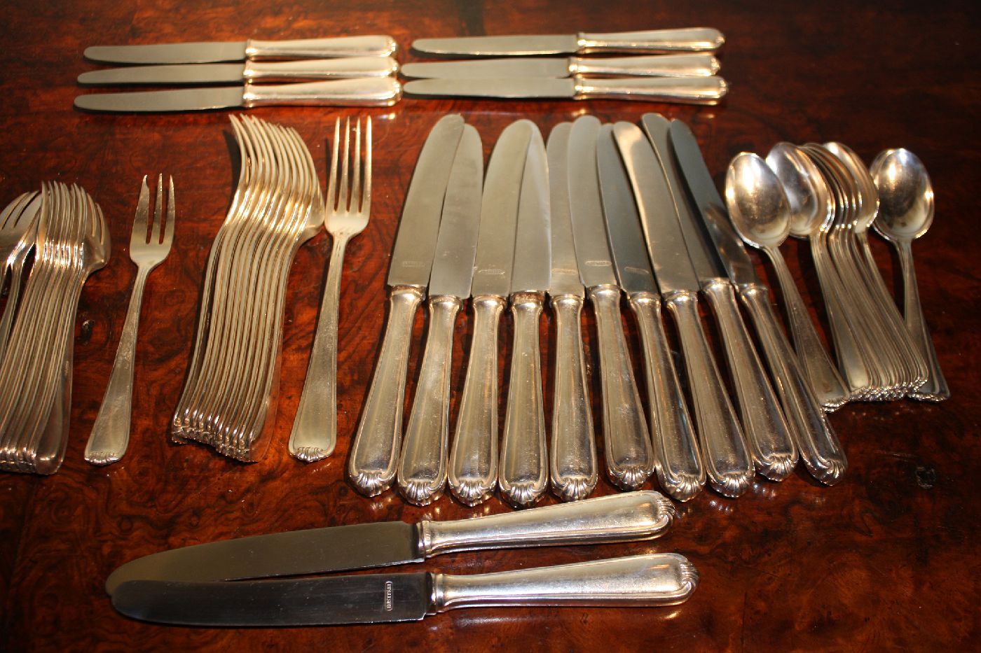 A 1900 dinnerware set of 12 forks, 12 knives, 12 dessert spoons, 11 small forks, 6 small knives, marked by 'Bremer Silberwarenfabrik'