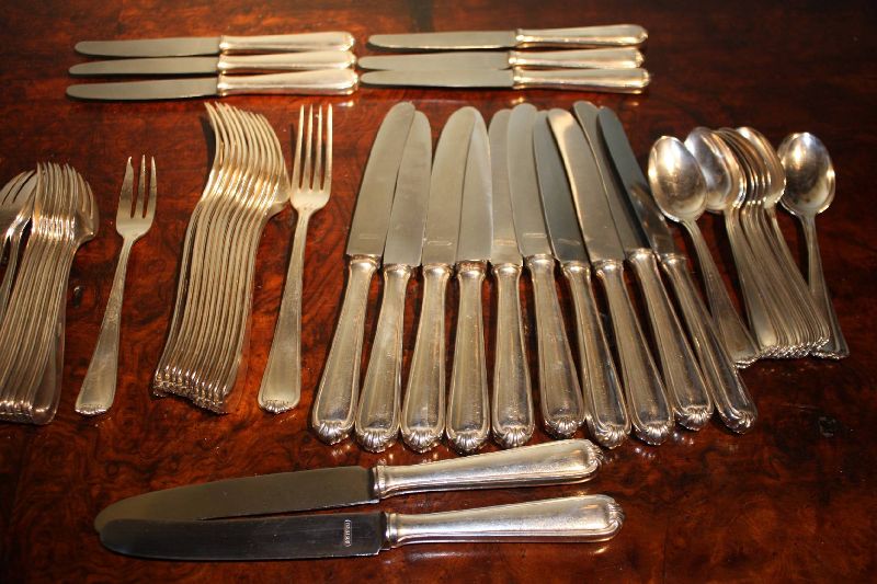 A 1900 dinnerware set of 12 forks, 12 knives, 12 dessert spoons, 11 small forks, 6 small knives, marked by 'Bremer Silberwarenfabrik'