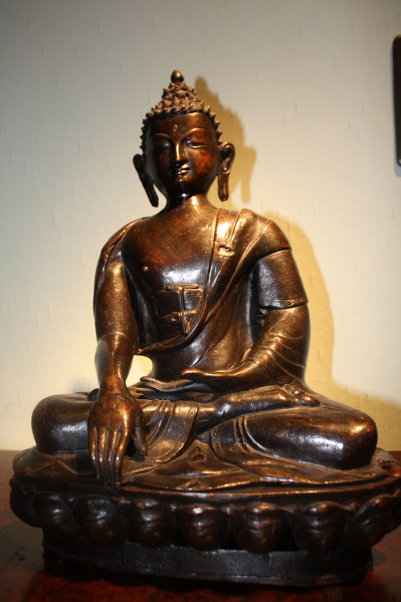 A large bronze cast metal 19th century Tibet Buddha statue, Buddha sitting on a lotus seat and touching the earth
