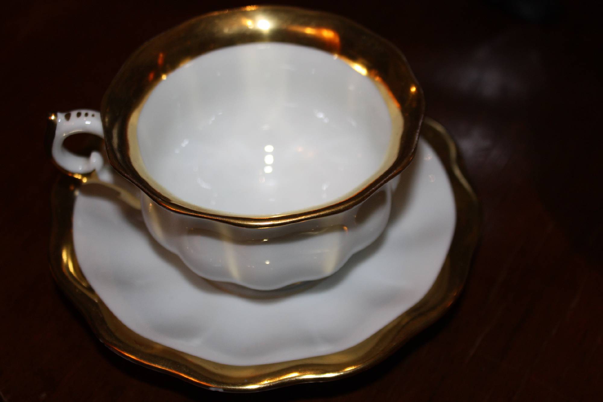 A second half 20th century white and golden tea or coffee serving set by Fuerstenberg, Germany, 10 cups and saucers, 27 parts