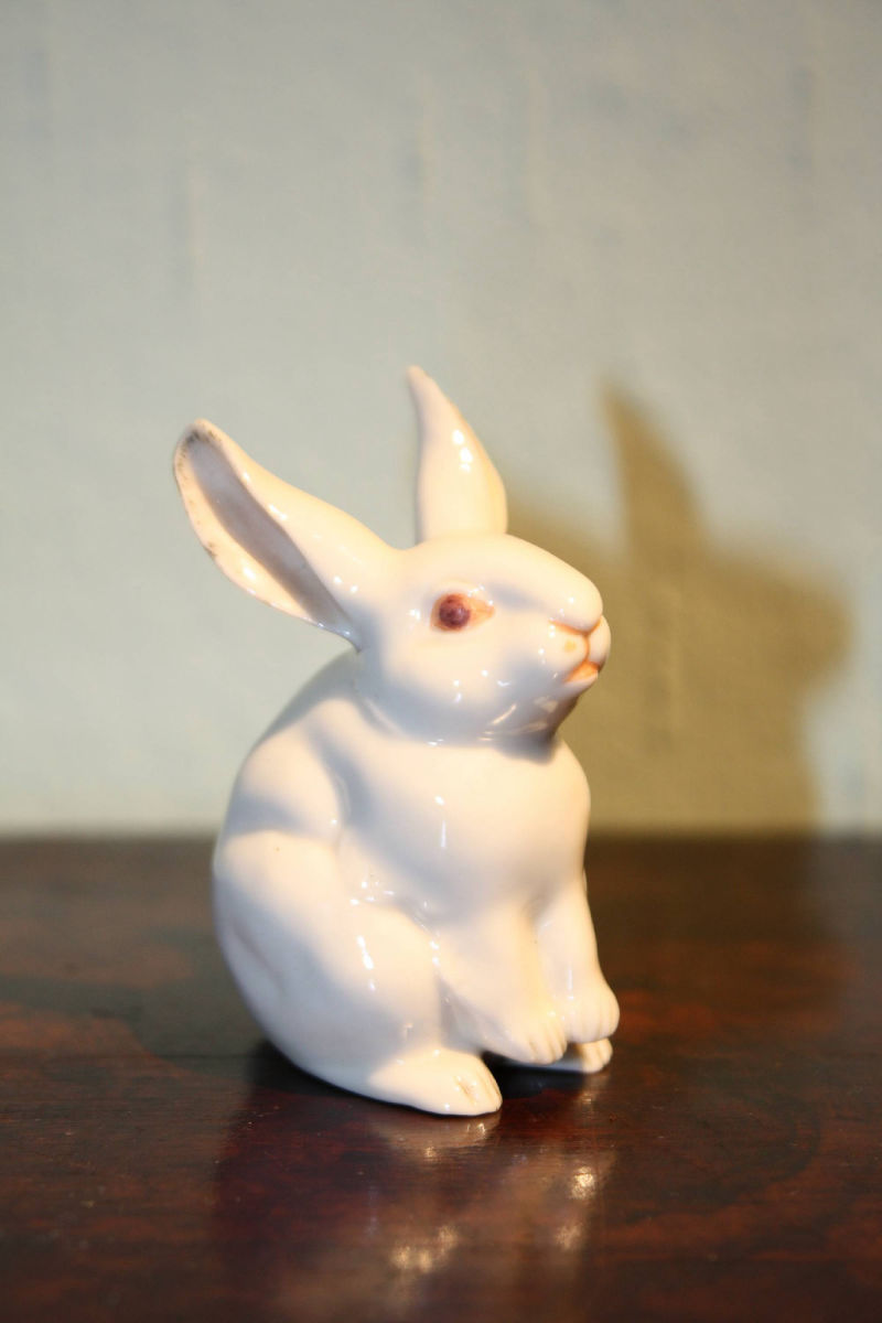 A very small vintage antique 1900 porcelain figurine rabbit by Nymphenburg, Germany