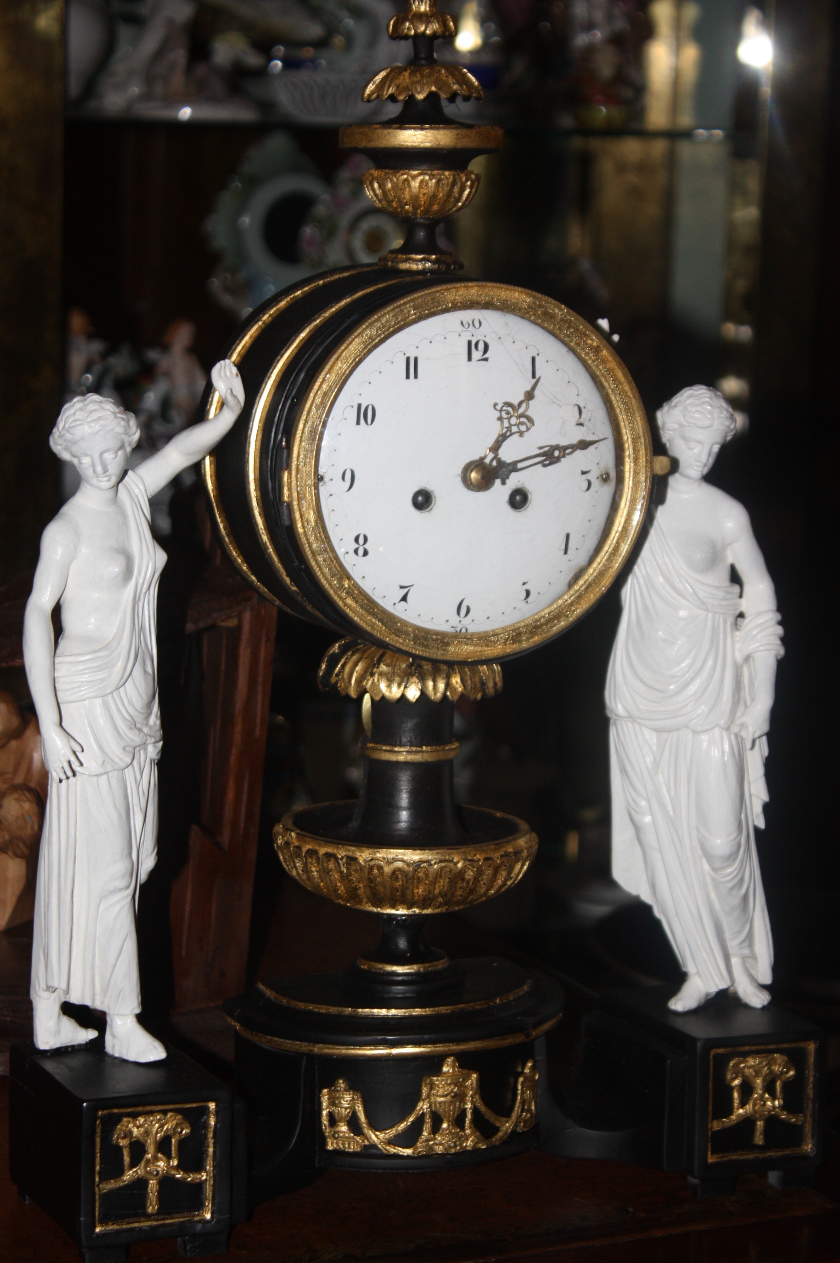 An 1820 Vienna table clock handcarved lime wood case