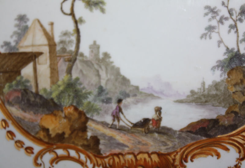 An 18th century Meissen plate with handpainted romantic scene