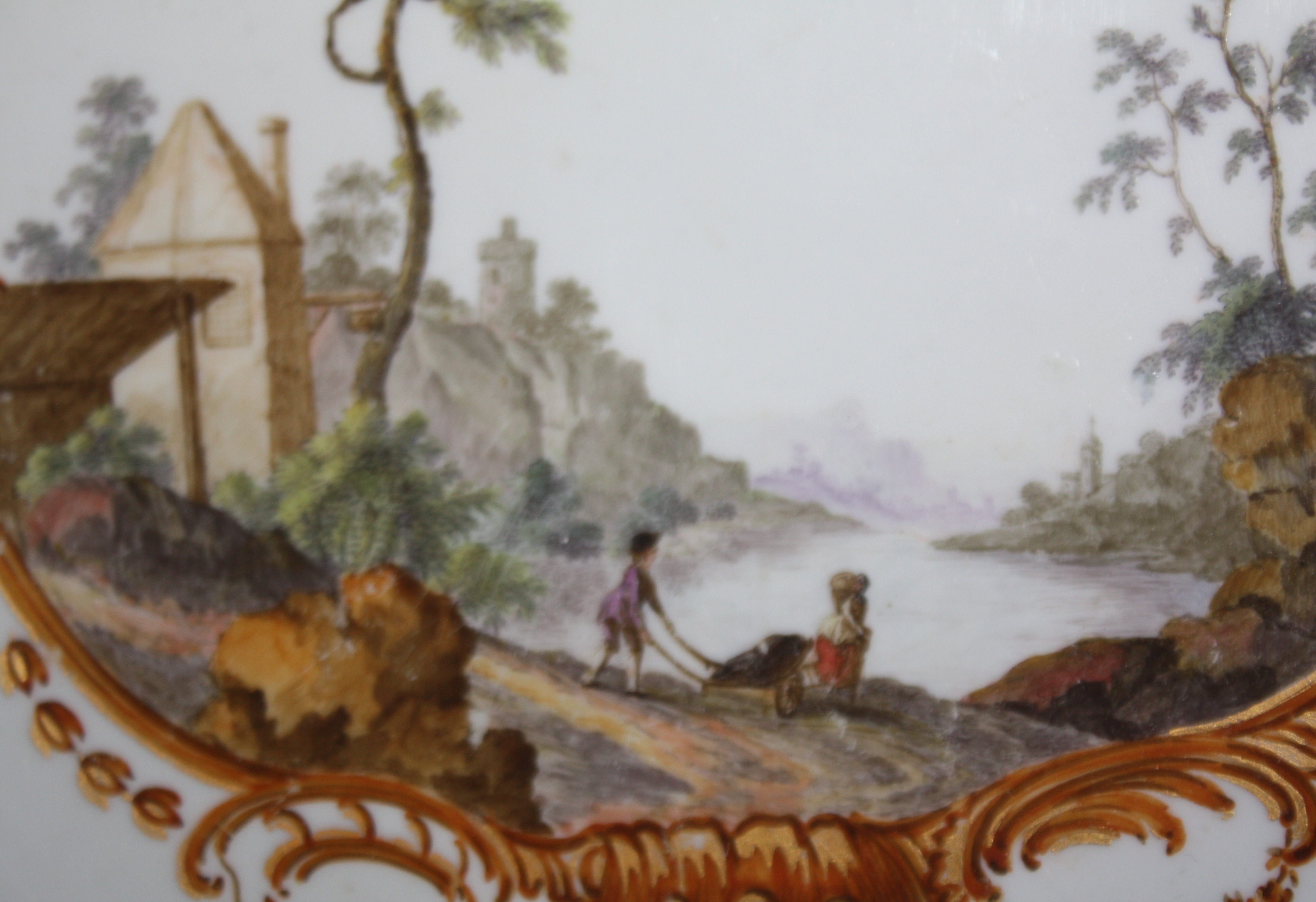 An 18th century Meissen plate with handpainted romantic scene
