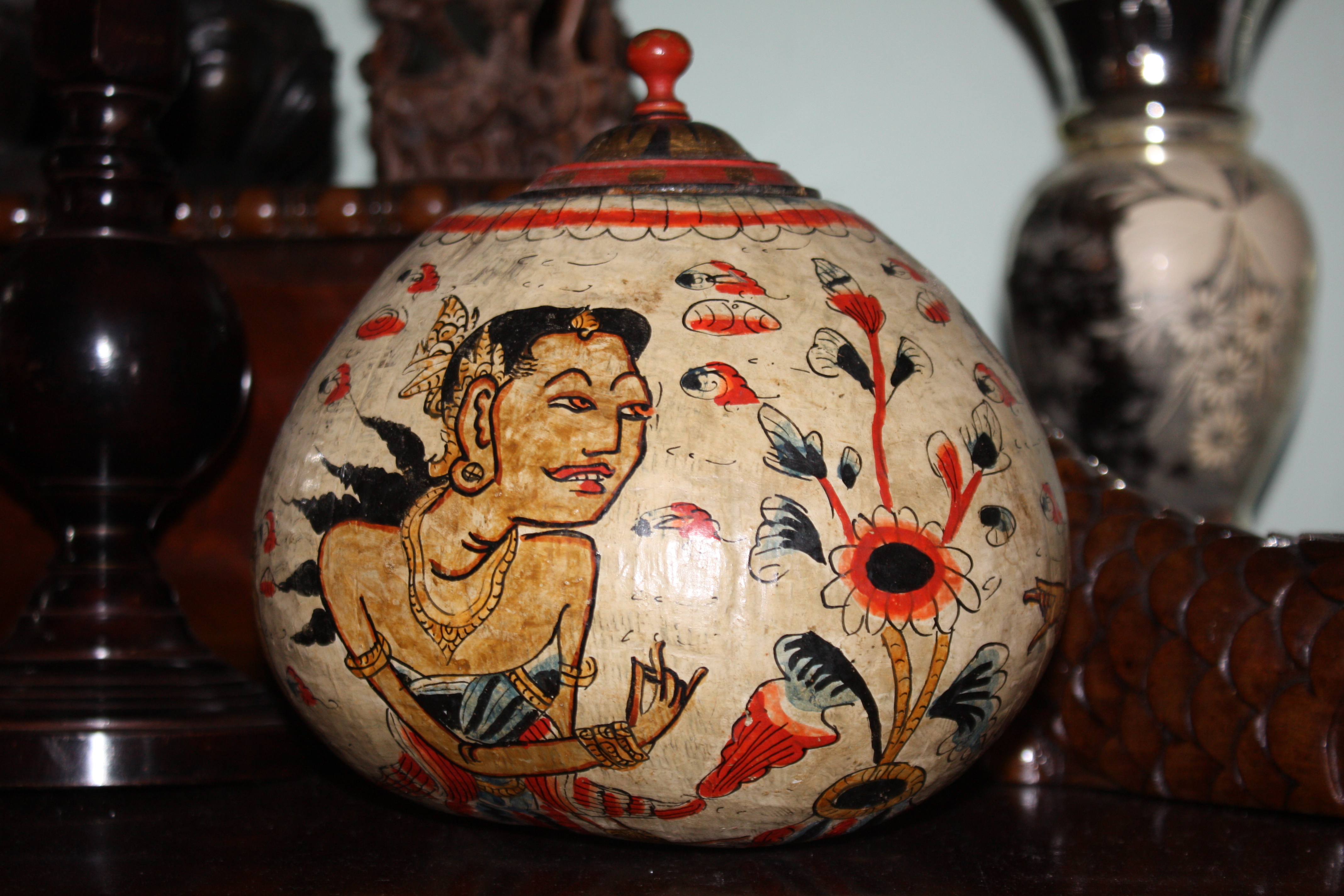 A nice old painted coconut Indonesia