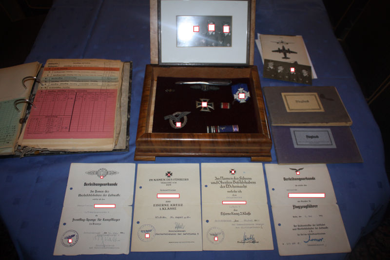 A complete WW2 estate of a German STUKA pilot with all badges certificates and 2 Flight Logs
