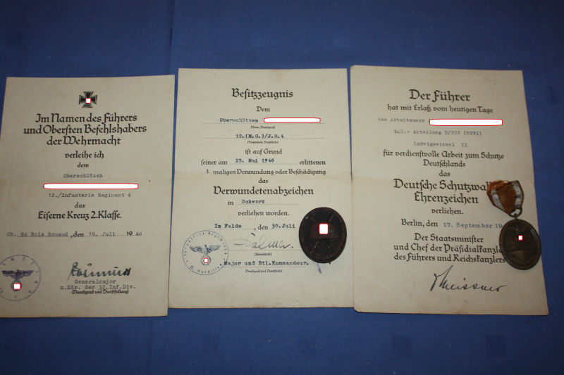 3 WW2 certificates with badges Schutzwall-Ehrenzeichen Verwundetenabzeichenn