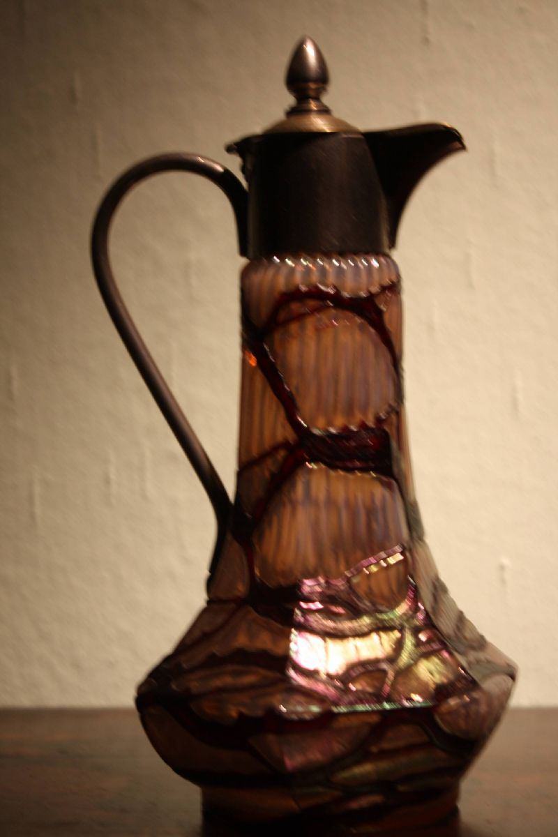A small vintage Bohemian 1910 Art Nouveau iridescent pink and violet glass pitcher jug by 'Wilhelm Kralik and sons'