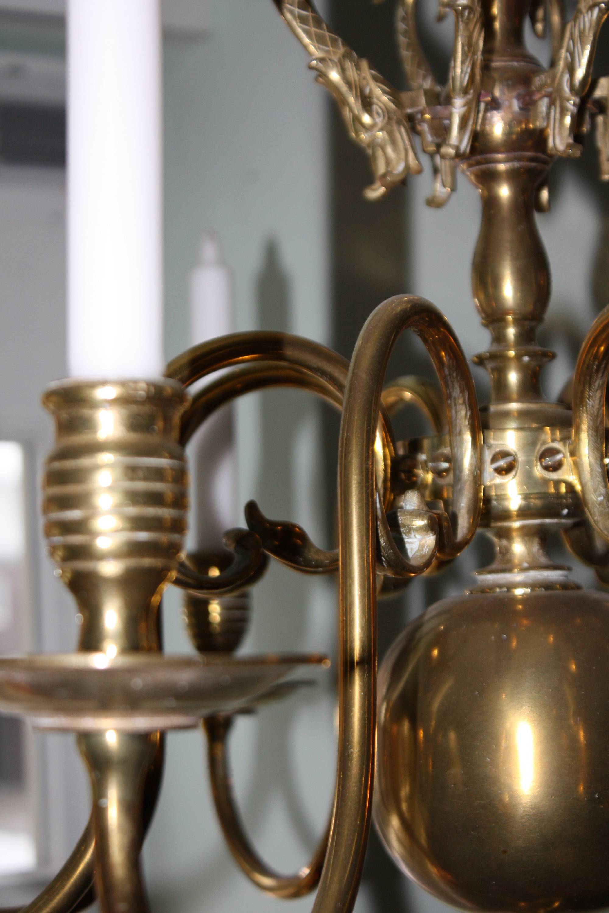 A 19th century flamish or dutch all brass antique chandelier with 8 arms