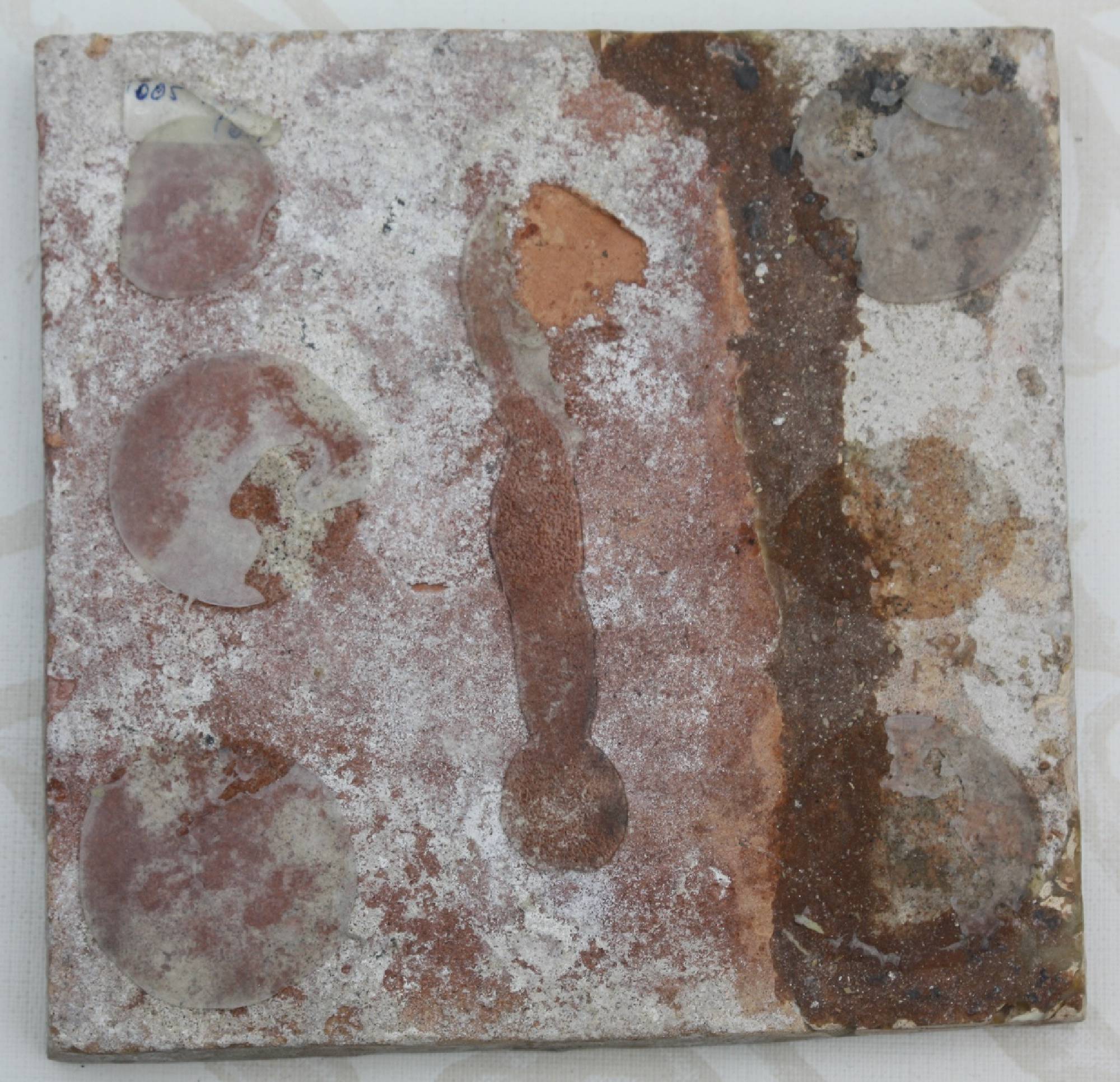 First half 17th century hand-painted antique polychrome Dutch stoneware medallion tile, showing a musketeer