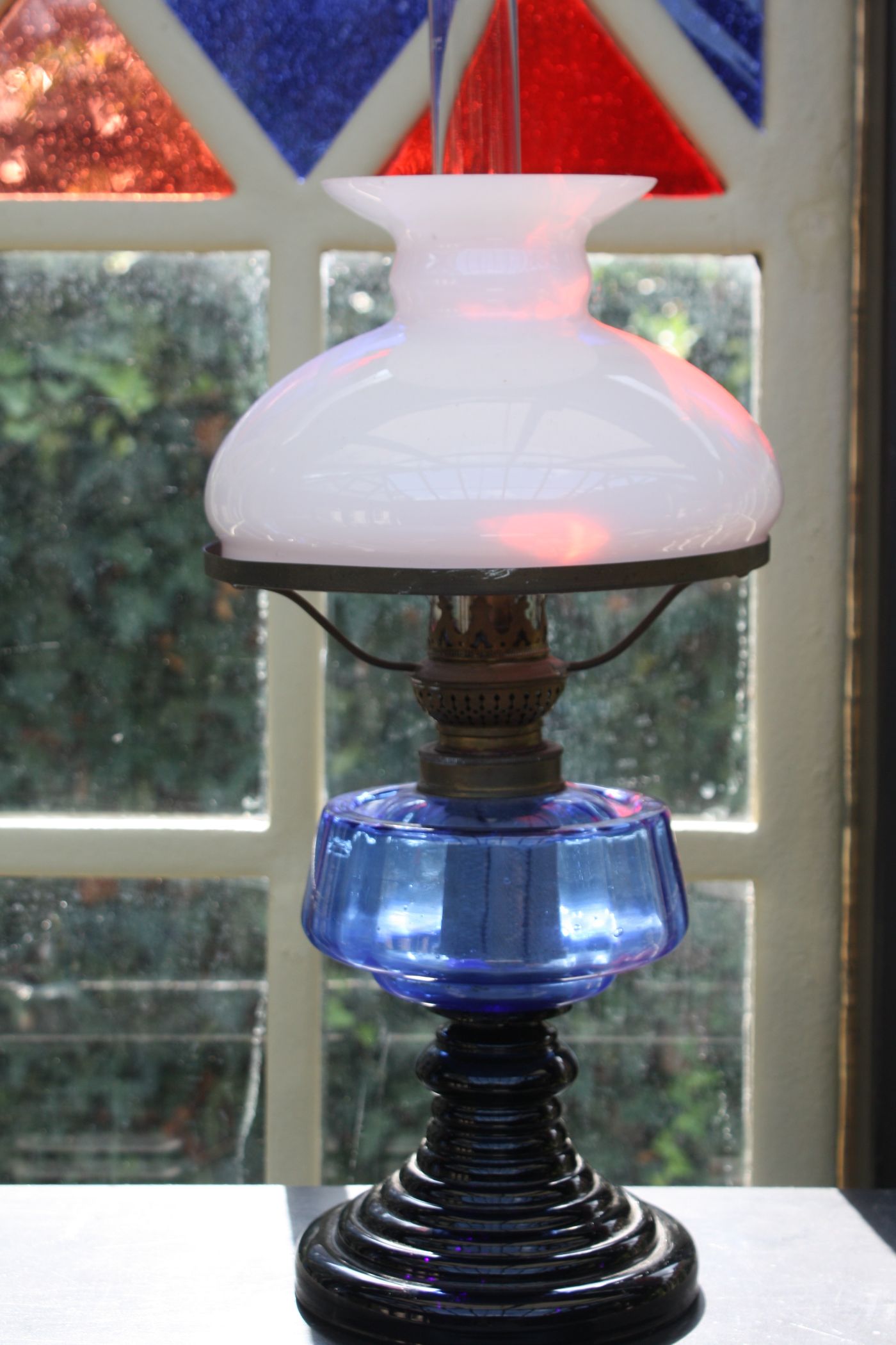 A nice antique blue and black glass kerosine table lamp, Height: 17.72'' (45 cm)