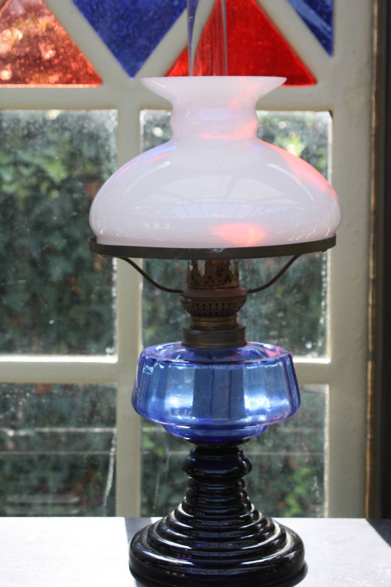 A nice antique blue and black glass kerosine table lamp, Height: 17.72'' (45 cm)