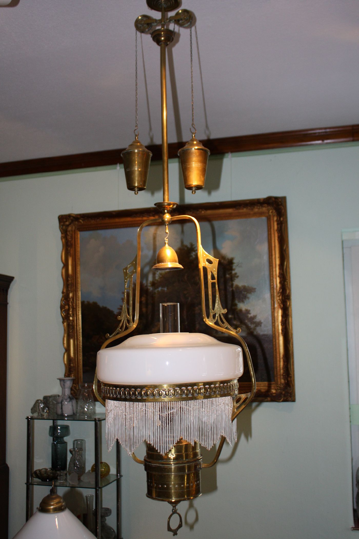 A 1900 Art Nouveau height adjustable brass kerosene ceiling light