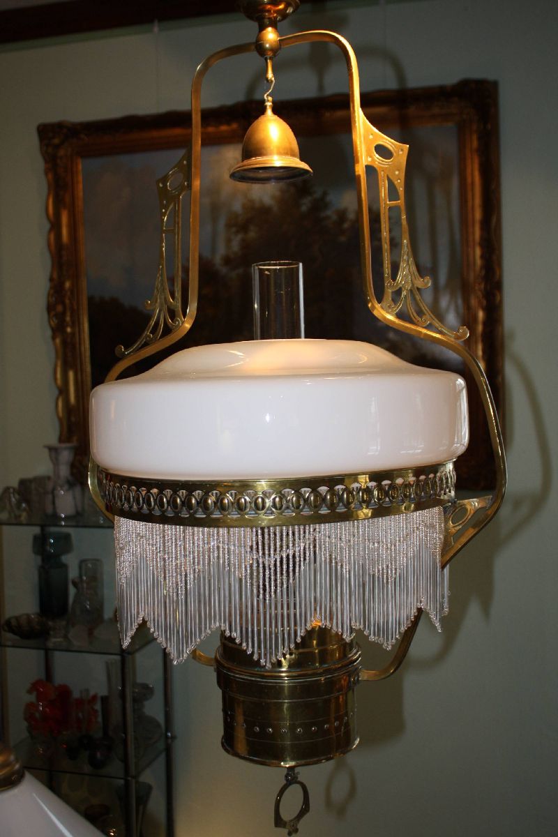 A 1900 Art Nouveau height adjustable brass kerosene ceiling light