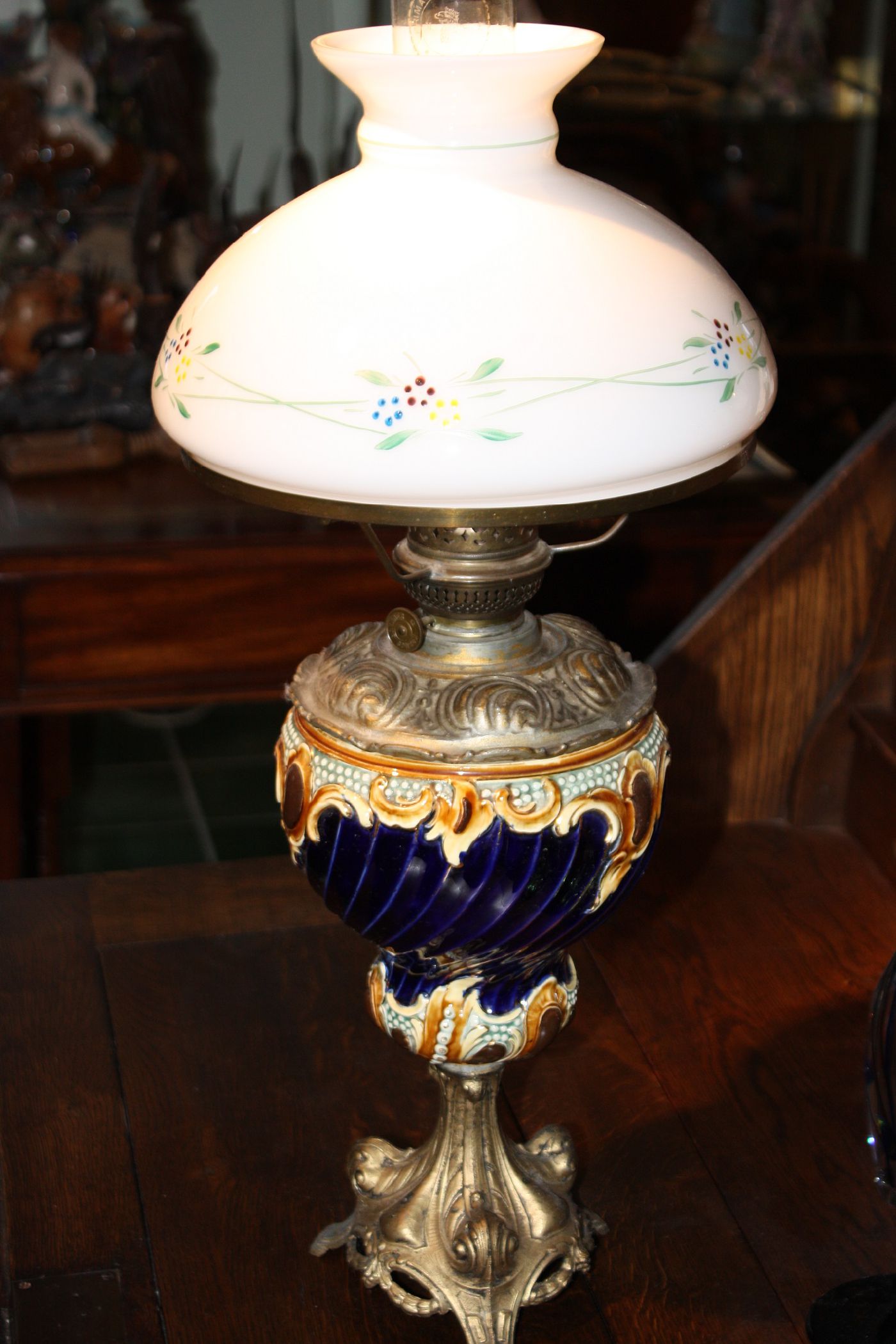 Antique 1900's Austrian Kerosene Lamp, polychrome ornamented stoneware font, gold-coloured cast iron base, Kosmos burner