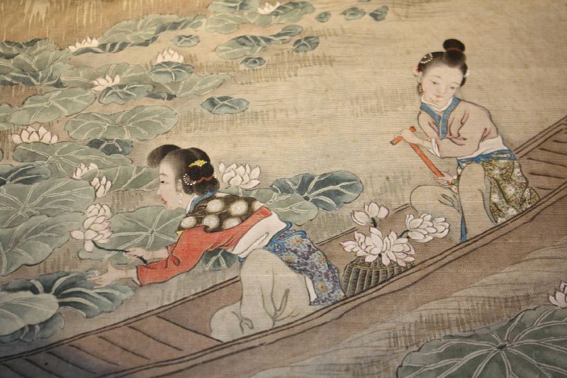 Antique 19th century Asian Japanese silk painting showing two women on a boat collecting lotus flowers