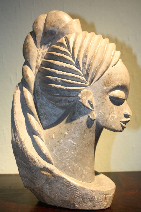 An African stone sculpture of an African woman