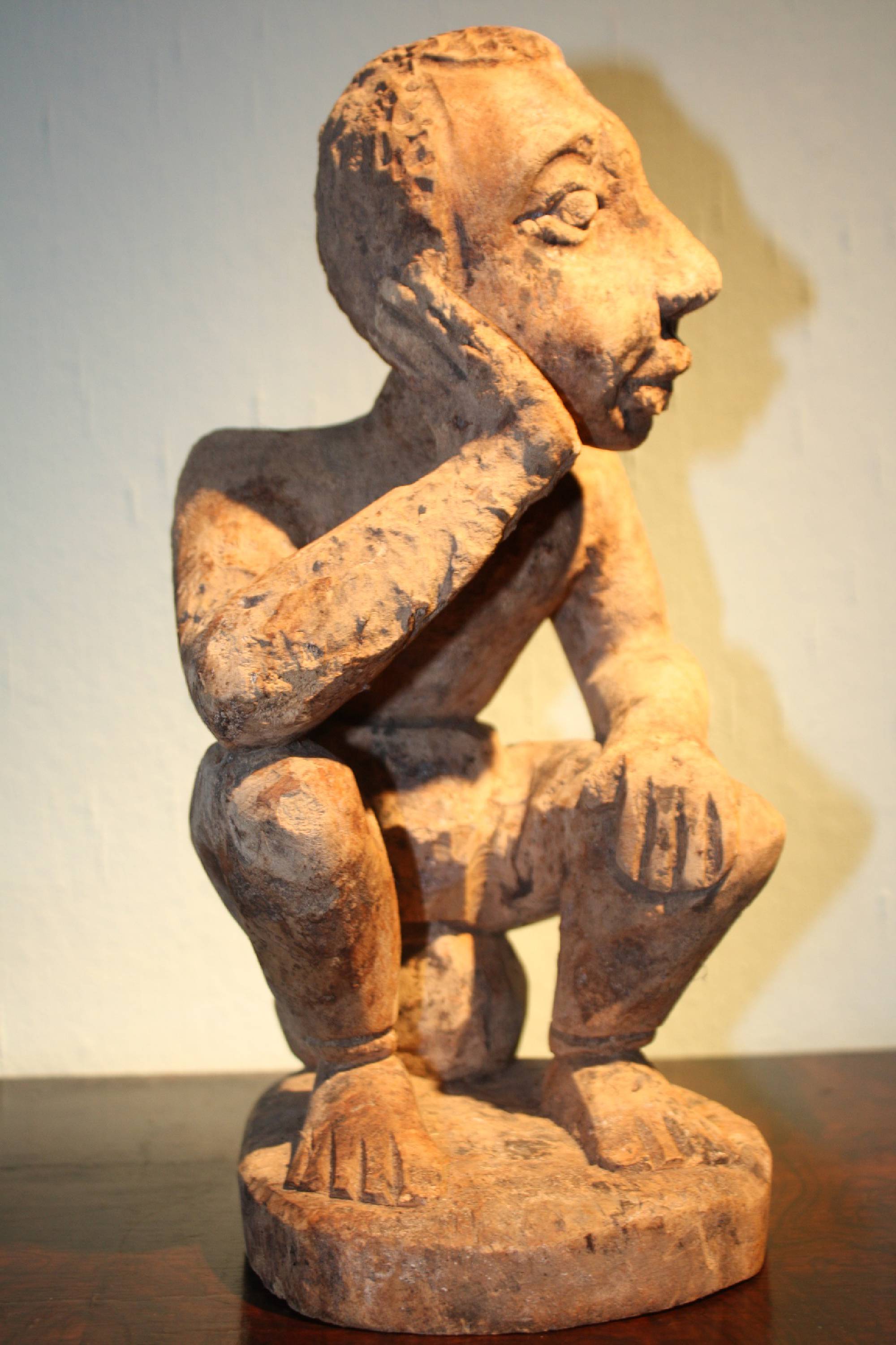 A rare wooden handcarved African tribal Ewe, Togo figure of a thinking man