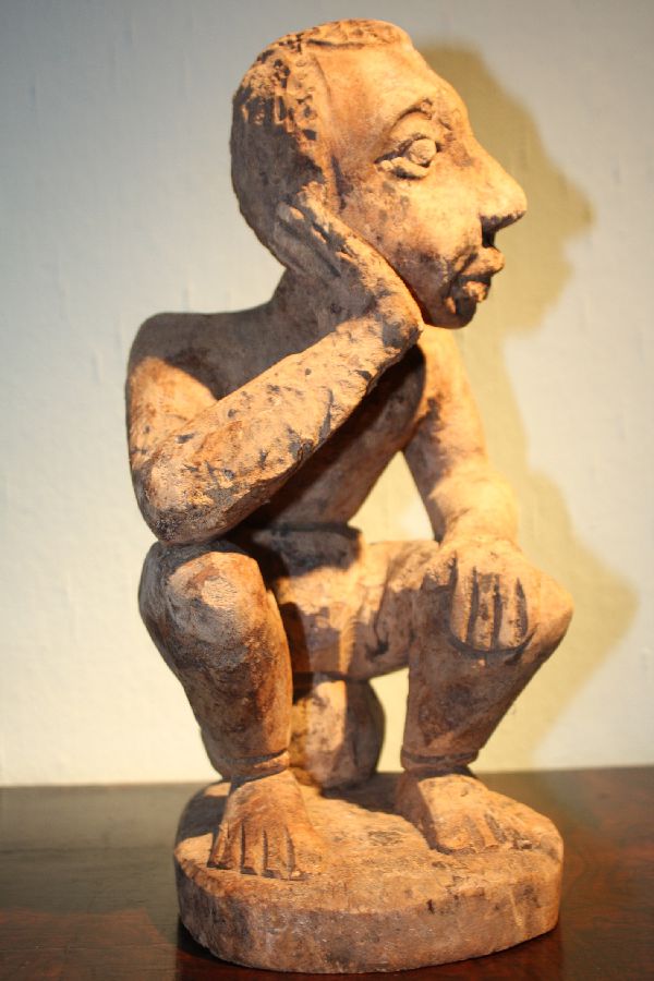 A handcarved African tribal Ewe, Togo figure of a thinking man