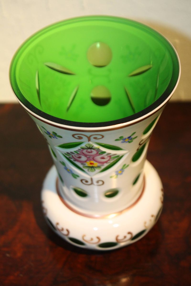 A cute vintage Bohemian 19th century green glass, white milk glass overlay and painted flowers vase