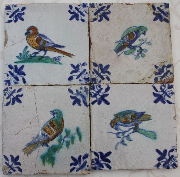 Four Dutch, first half 17th century polychrome Delft stoneware bird tiles